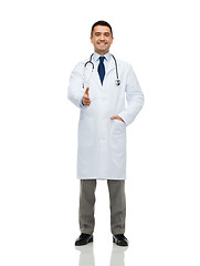 Image showing smiling doctor in white coat making handshake