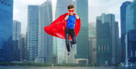 Image showing boy in super hero cape and mask showing thumbs up