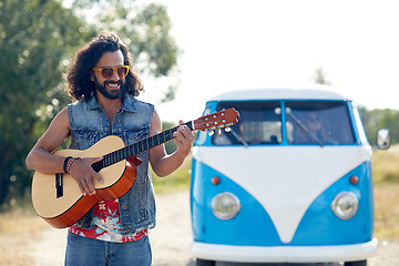 Image showing hippie man playing guitar over minivan car outdoor