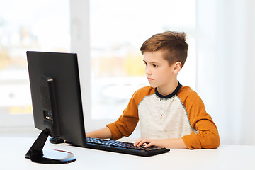 Image showing boy with computer at home