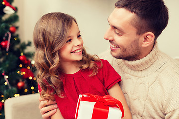 Image showing smiling father and daughter looking at each other