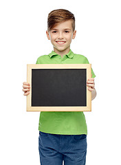 Image showing happy boy in t-shirt holding blank chalk board