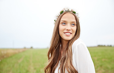 Image showing smiling young hippie woman on cereal field