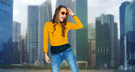 Image showing happy young woman or teen girl over city