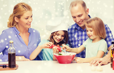 Image showing happy family with two kids making salad at home