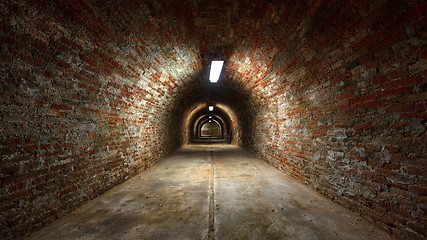 Image showing Long underground brick tunnel angle shot