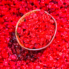 Image showing Scoop of dry cranberries.