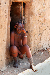 Image showing Himba woman with ornaments on the neck in the village