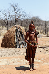 Image showing Himba woman with ornaments on the neck in the village