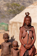 Image showing Himba woman with child in the village