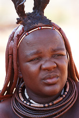 Image showing Himba woman with ornaments on the neck in the village