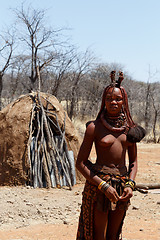 Image showing Himba woman with ornaments on the neck in the village