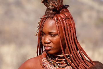 Image showing Himba woman with ornaments on the neck in the village