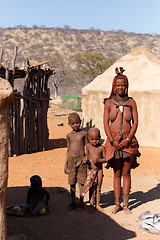 Image showing Himba woman with child in the village