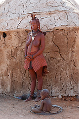 Image showing Himba woman with ornaments on the neck in the village