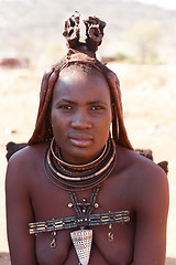 Image showing Himba woman with ornaments on the neck in the village