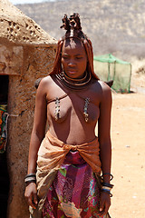 Image showing Himba woman with ornaments on the neck in the village