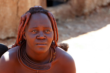 Image showing Himba woman with ornaments on the neck in the village