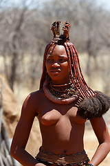 Image showing Himba woman with ornaments on the neck in the village