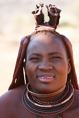 Image showing Himba woman with ornaments on the neck in the village