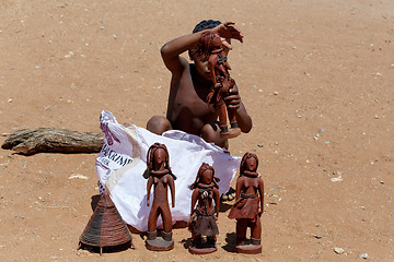 Image showing Himba child  with souvenirs for sale in traditional village