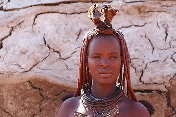 Image showing Himba woman with ornaments on the neck in the village