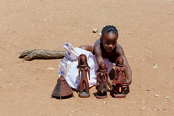 Image showing Himba child  with souvenirs for sale in traditional village