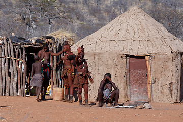 Image showing Himba and zemba woman with ornaments on the neck in the village