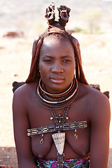 Image showing Himba woman with ornaments on the neck in the village