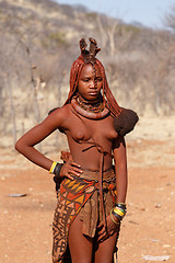 Image showing Himba woman with ornaments on the neck in the village