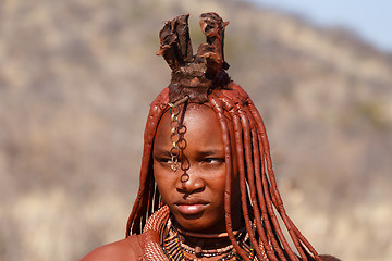 Image showing Himba woman with ornaments on the neck in the village