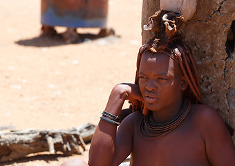 Image showing Himba woman with ornaments on the neck in the village