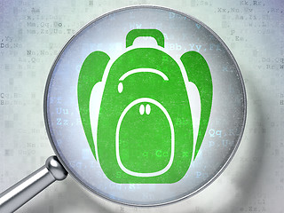 Image showing Studying concept: Backpack with optical glass on digital background