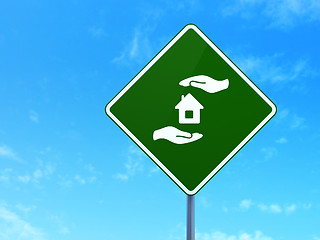 Image showing Insurance concept: House And Palm on road sign background