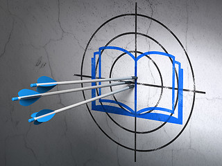 Image showing Studying concept: arrows in Book target on wall background