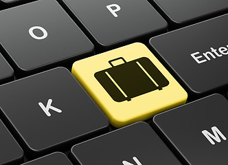 Image showing Vacation concept: Bag on computer keyboard background