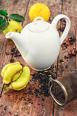 Image showing White teapot and fruit