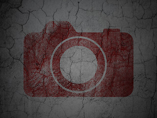 Image showing Travel concept: Photo Camera on grunge wall background