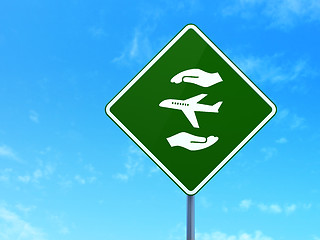 Image showing Insurance concept: Airplane And Palm on road sign background