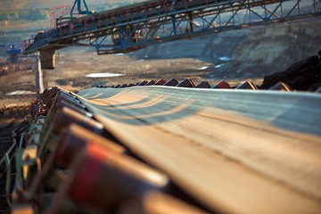 Image showing Long conveyor belt transporting ore