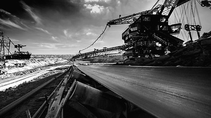 Image showing Long conveyor belt transporting ore