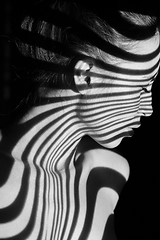 Image showing The face of woman with black and white zebra stripes