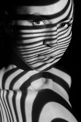 Image showing The face of woman with black and white zebra stripes