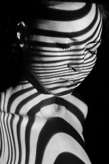 Image showing The face of woman with black and white zebra stripes