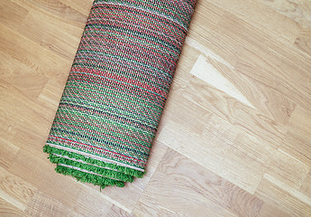 Image showing rolled carpet on the floor
