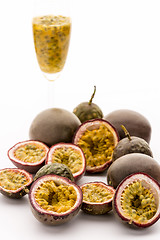 Image showing Passion Fruit Flesh In Its Rind And In A Glass