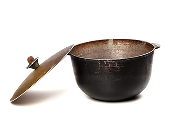 Image showing Open old black pot with lid