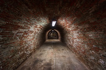 Image showing Long underground brick tunnel angle shot