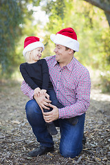 Image showing Portrait of Father and Daughter Wearing Santa Hats