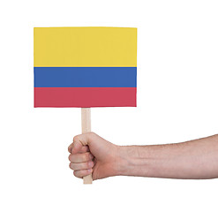 Image showing Hand holding small card - Flag of Colombia